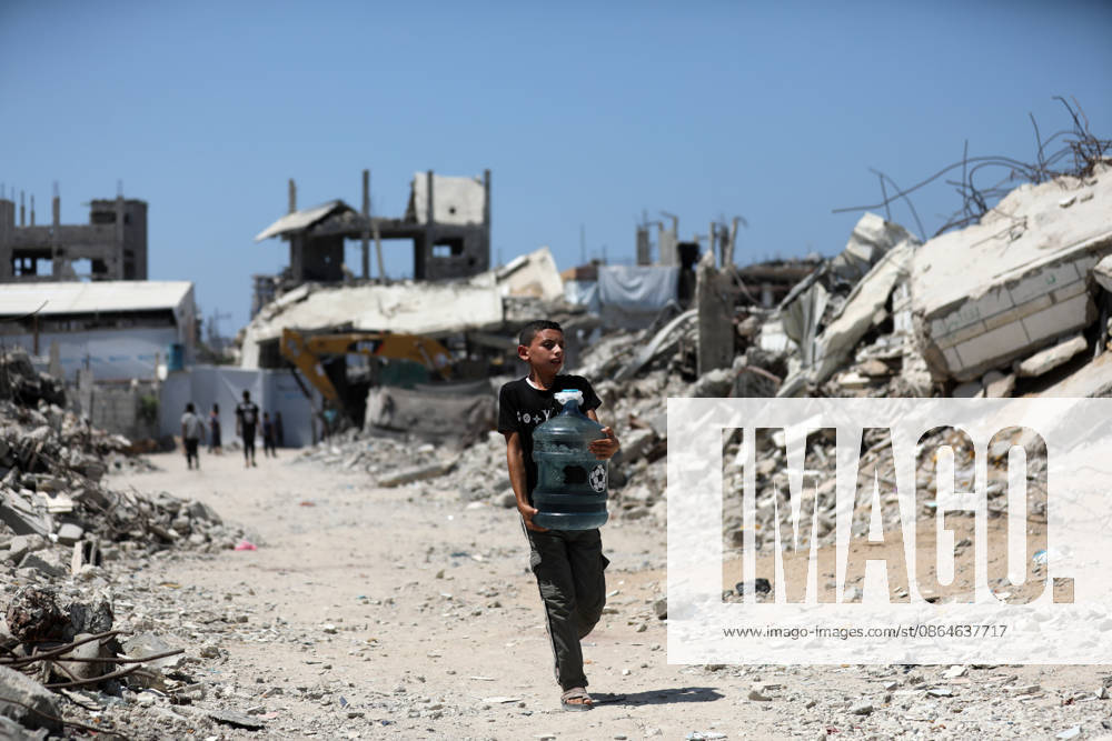 Displaced Palestinians Continue Daily Life Near Ruined Homes in Gaza City Displaced Palestinians try to continue their daily life near their destroyed homes in the Zeitoun neighborhood of Gaza City, on August 23, 2026. Residents are living in tents and temporary shelters beside the rubble of buildings destroyed during the war. Photo by Bilal Osama apaimages Gaza city Gaza Strip Palestinian Territory 230826_Gaza_BO_01(1)
