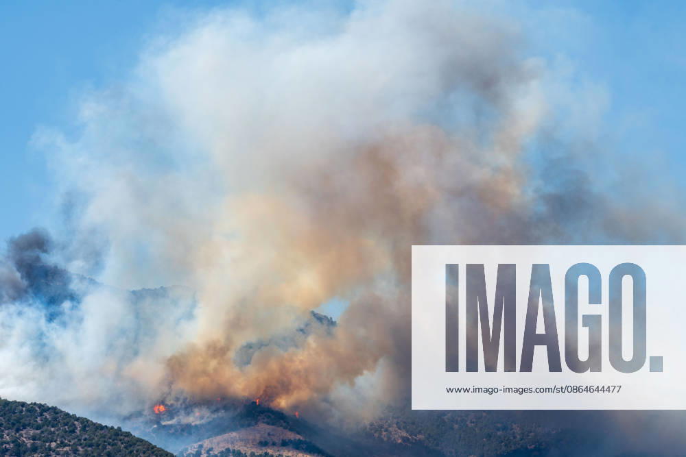 Smoke and flames are visible on a hillside as the Big Mountain Fire burns southwest of Elberta, Utah, United States, on August 23, 2026. State and local air and ground resources were deployed to fight the wildland fire, which rapidly reached an estimated 30 acres with zero containment. Elberta USA - ZUMAm292 20260823_znp_m292_019