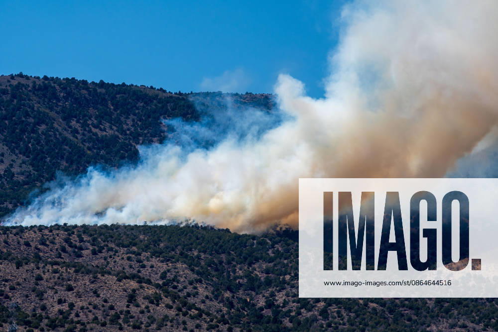Smoke and flames are visible on a hillside as the Big Mountain Fire burns southwest of Elberta, Utah, United States, on August 23, 2026. State and local air and ground resources were deployed to fight the wildland fire, which rapidly reached an estimated 30 acres with zero containment. Elberta USA - ZUMAm292 20260823_znp_m292_025