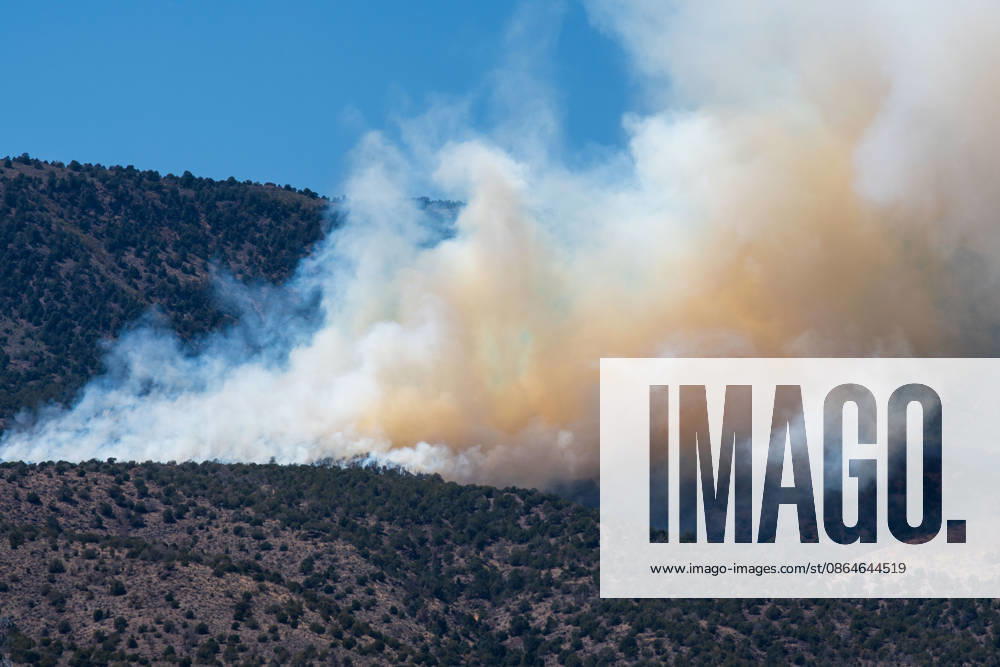 Smoke and flames are visible on a hillside as the Big Mountain Fire burns southwest of Elberta, Utah, United States, on August 23, 2026. State and local air and ground resources were deployed to fight the wildland fire, which rapidly reached an estimated 30 acres with zero containment. Elberta USA - ZUMAm292 20260823_znp_m292_027