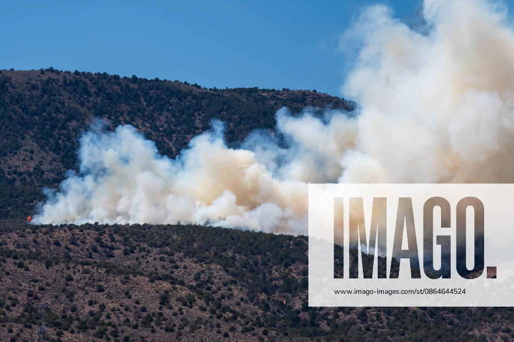 Smoke and flames are visible on a hillside as the Big Mountain Fire burns southwest of Elberta, Utah, United States, on August 23, 2026. State and local air and ground resources were deployed to fight the wildland fire, which rapidly reached an estimated 30 acres with zero containment. Elberta USA - ZUMAm292 20260823_znp_m292_028