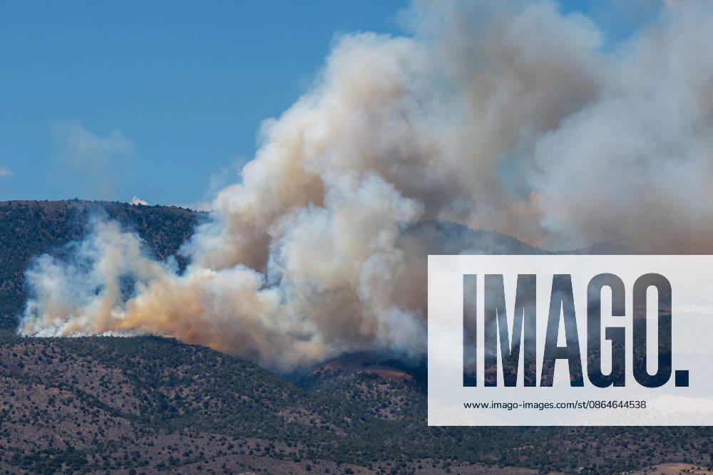 Smoke and flames are visible on a hillside as the Big Mountain Fire burns southwest of Elberta, Utah, United States, on August 23, 2026. State and local air and ground resources were deployed to fight the wildland fire, which rapidly reached an estimated 30 acres with zero containment. Elberta USA - ZUMAm292 20260823_znp_m292_030