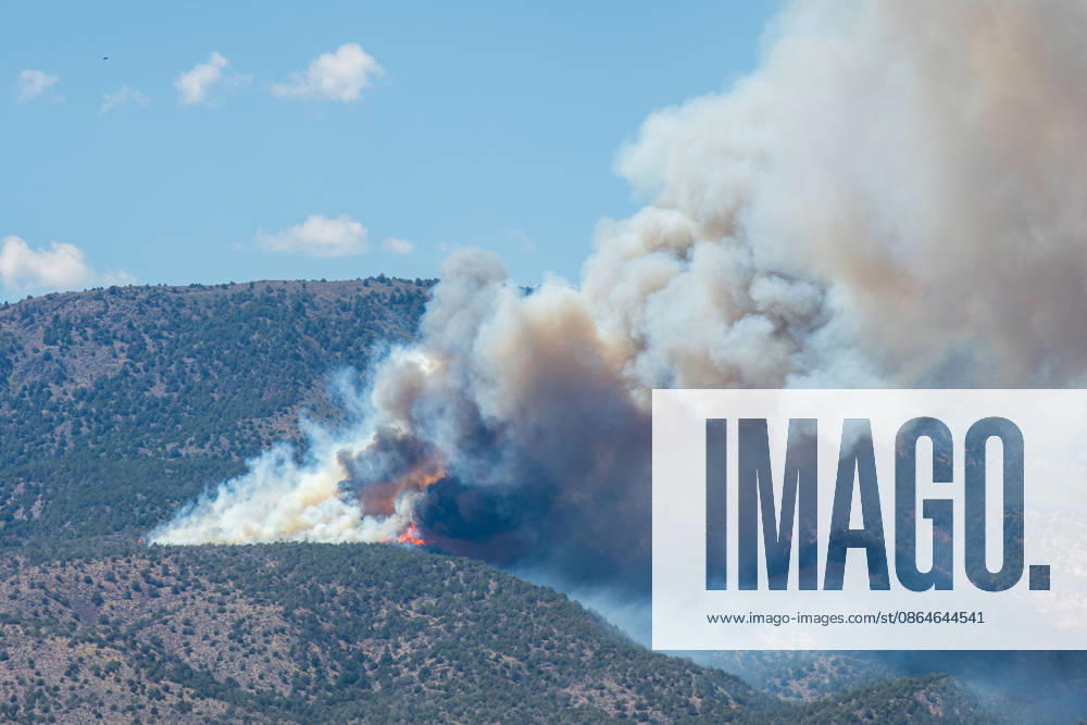 Smoke and flames are visible on a hillside as the Big Mountain Fire burns southwest of Elberta, Utah, United States, on August 23, 2026. State and local air and ground resources were deployed to fight the wildland fire, which rapidly reached an estimated 30 acres with zero containment. Elberta USA - ZUMAm292 20260823_znp_m292_032