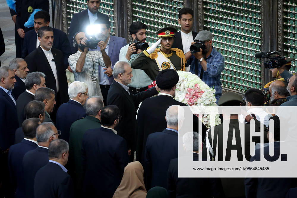 President Masoud Pezeshkian (C) attends an event to mark the first day of the Government Week at the mausoleum of Ayatollah Ruhollah Khomeini, the founder of the Islamic Republic of Iran, in Tehran, Iran on August 23, 2026. Iranian President Masoud Pezeshkian declared that no power will be able to force the Iranian people into surrender. He dismissed claims that sanctions would turn Iran into another Venezuela, saying that has not happened. He stressed the need to begin conserving gasoline consumption through government measures, including a plan to reduce the number and fuel use of government vehicles. IRN2026082312 IranianxPresidency