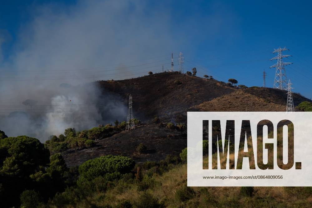 Wildfire Rages in Collserola. BARCELONA, SPAIN - AUGUST 25, 2026. Firefighters battle a devastating wildfire that has scorched dozens of hectares in Collserola Natural Park, prompting the precautionary evacuation of the Can Masdeu social center and several residential homes in the Torre Baro neighborhood. Barcelona Spain