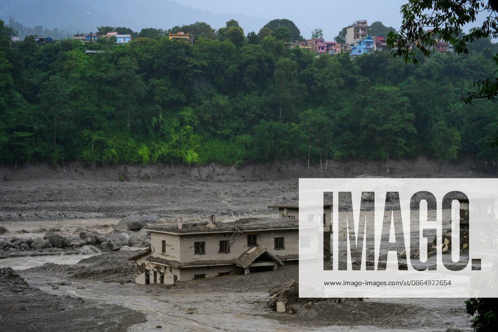 NUWAKOT, NEPAL - AUGUST 26: An aftermath view of flash floods and mudslides along the Trishuli River in Nuwakot, Nepal, on August 26, 2026. A catastrophic flash flood swept through Nepalâ€⠢s northern border region after an ice-and-rock avalanche, reportedly triggered by an earthquake, caused a sudden surge in the Lhende River on the Nepal-China border and sent massive volumes of water, mud and debris downstream into the Bhote Koshi and Trishuli river systems. The disaster devastated settlements in Rasuwa and Nuwakot districts, sweeping away homes, roads, bridges, vehicles and other infrastructure and severely damaging hydropower and power facilities. In Nuwakot, riverside settlements includin - ZUMAs330 20260826_zsp_s330_001