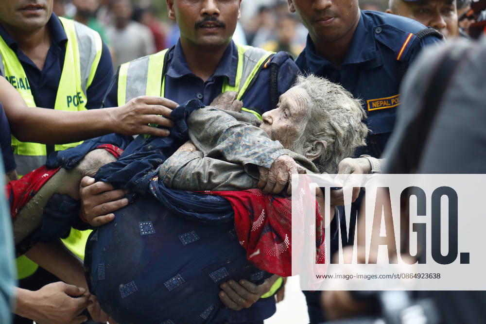 An elderly woman is rescued from buildings and infrastructure that were damaged along the swollen Trishuli River following a massive flash flood triggered by an avalanche of ice and rock in the upper Lhende River on the Tibetan side, in Nuwakot district, Nepal, on Wednesday, August 26, 2026. The sudden flood swept through communities along the Bhote Koshi and Trishuli river systems, destroying homes, roads and bridges and leaving widespread devastation downstream. Nuwakot Nepal - ZUMAg200 20260826_zap_g200_016
