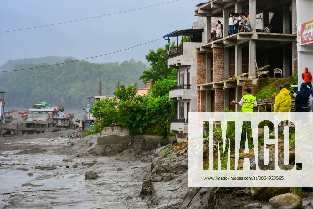 NUWAKOT, NEPAL - AUGUST 26, 2026: An aftermath view of flash floods and mudslides along the Trishuli River. A catastrophic flash flood swept through Nepalâ€⠢s northern border region after an ice-and-rock avalanche, reportedly triggered by an earthquake, caused a sudden surge in the Lhende River on the Nepal-China border and sent massive volumes of water, mud and debris downstream into the Bhote Koshi and Trishuli river systems. The disaster devastated settlements in Rasuwa and Nuwakot districts, sweeping away homes, roads, bridges, vehicles and other infrastructure and severely damaging hydropower and power facilities. In Nuwakot, riverside settlements including Trishuli Bazaar, Devighat, Betr - ZUMAq101 20260826_zna_q101_033