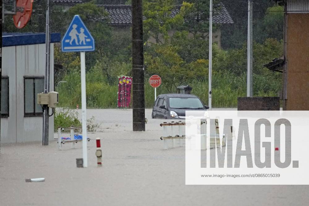 Torrential rain in central Japan Photo taken on Aug. 27, 2026, shows a submerged vehicle in Himi in Toyama Prefecture, central Japan, following torrential rain. A14AA0005626688P