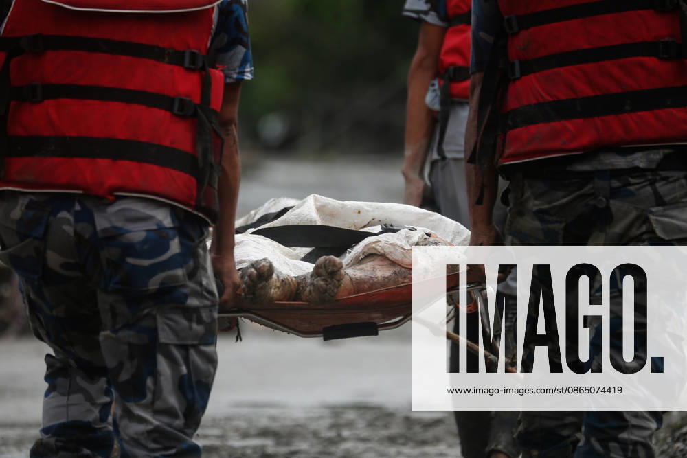 Nepal Disaster: The Second Day Of Devastation, Rescue And Recovery (EDITORS NOTE: Image depicts death.) Security personnel collect the bodies of flood victims in Nuwakot, Nepal, on August 27, 2026, following an outburst of a glacial lake in Tibet. Rescue and recovery operations continue in the flood-affected area as authorities search for victims and assess the extent of the damage. Nuwakot Nepal