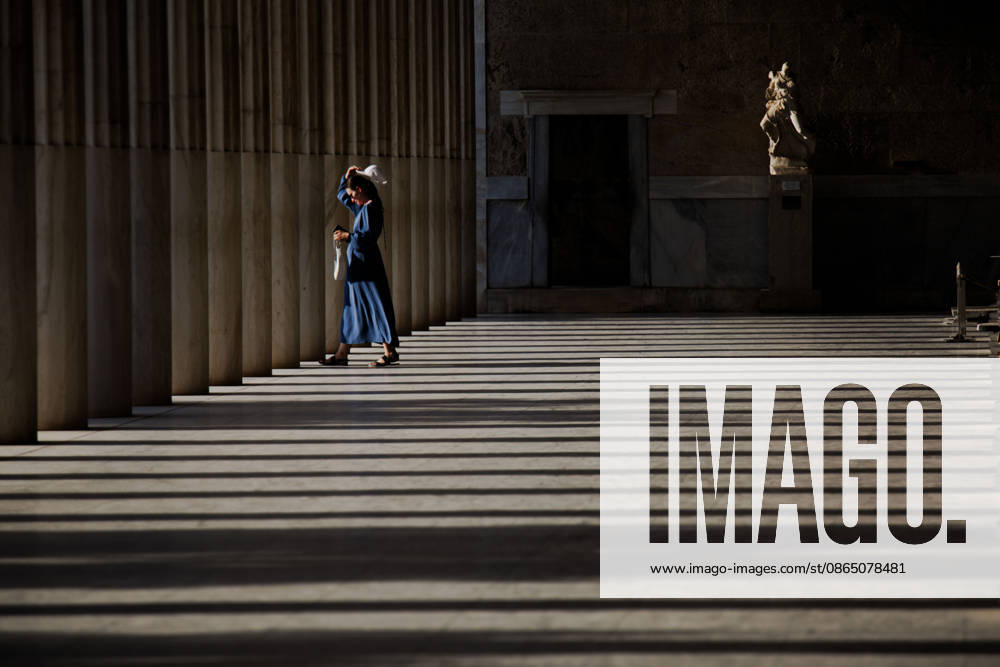 A tourist walks through the Stoa of Attalos at the Ancient Agora of Athens during hot summer weather. Athens Greece - ZUMAthen 20260827_mda_x103_783