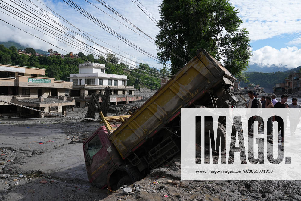A truck is stuck in mud after being swept away by flash floods on August 27, 2026 in Bidur, Nuwakot District, Nepal. Flash floods struck the Rasuwa district along Nepal s northern border on August 26, causing severe damage to roads, bridges and villages in Nuwakot, where helicopters are now the only means to transport people and supplies. Rescue and post-disaster cleanup operations are ongoing.