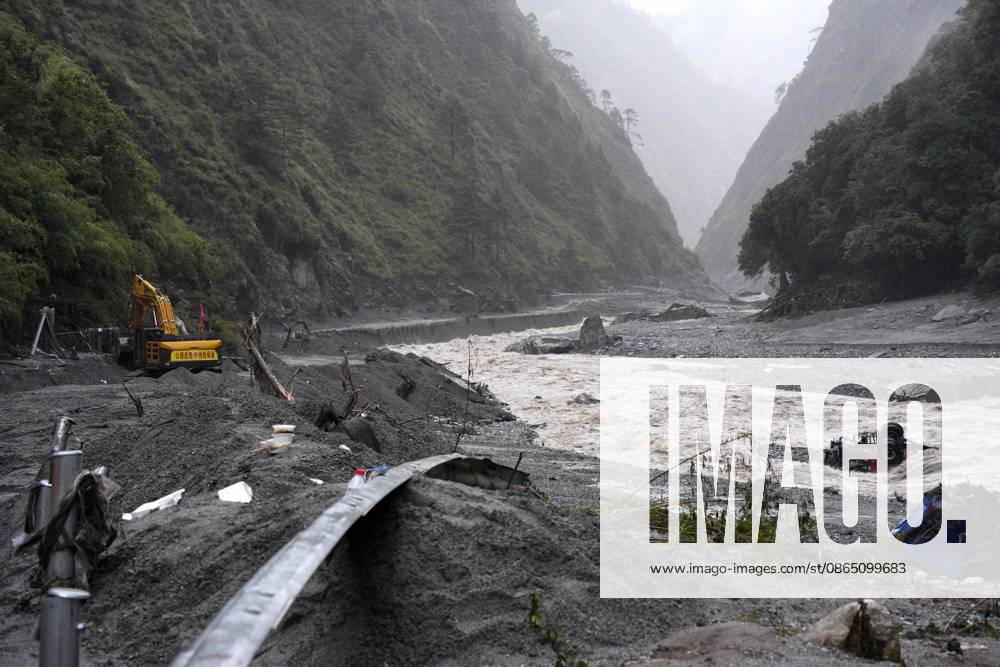 Excavators and loaders clear debris to restore traffic on a road section affected by a landslide on August 28, 2026 in Shigatse, Xizang Autonomous Region of China. Rescue efforts are underway after a mudslide struck near Gyirong Port in Gyirong County, Xigaze City, southwest China s Xizang Autonomous Region. Multiple rescue teams have been deployed to the affected area to search for missing people, clear roads and assess potential risks. Emergency supplies and rescue equipment have also been mobilized.