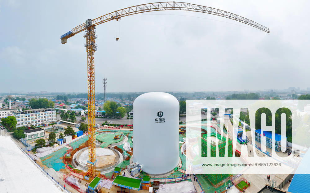 Workers carry out inflation operations for the first air dome grain storage unit at the construction site of the Central Reserve Grain Huaibei Direct Storage Depot project on August 28, 2026 in Huaibei, Anhui Province of China. The project is described as the largest air dome grain storage complex in the country.
