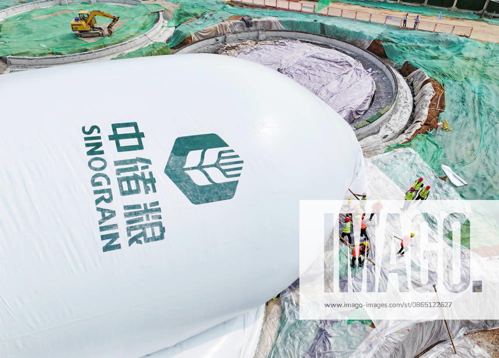Workers conduct inflation operations for the first air dome warehouse at the construction site of the Central Reserve Grain Huaibei Direct Storage Project on August 28, 2026 in Huaibei, Anhui Province of China. The project is reported as the largest air dome grain storage group in China.