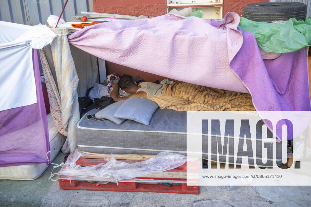 Day-to-Day Life of Migrants in the El Tarajal Industrial Park A person rests in a makeshift shelter in the El Tarajal Industrial Park on August 28, 2026, in Ceuta, Spain. Ceuta has announced plans to renovate the six industrial warehouses in the El Tarajal industrial park to transform them into a reception center. The project includes the installation of restrooms, kitchens, bedrooms, and other facilities. Depending on the condition of each warehouse, the project will also require the replacement of roofs, painting, and other repairs. AUGUST 28, 2026 MIGRATION CRISIS Ceuta, Spain