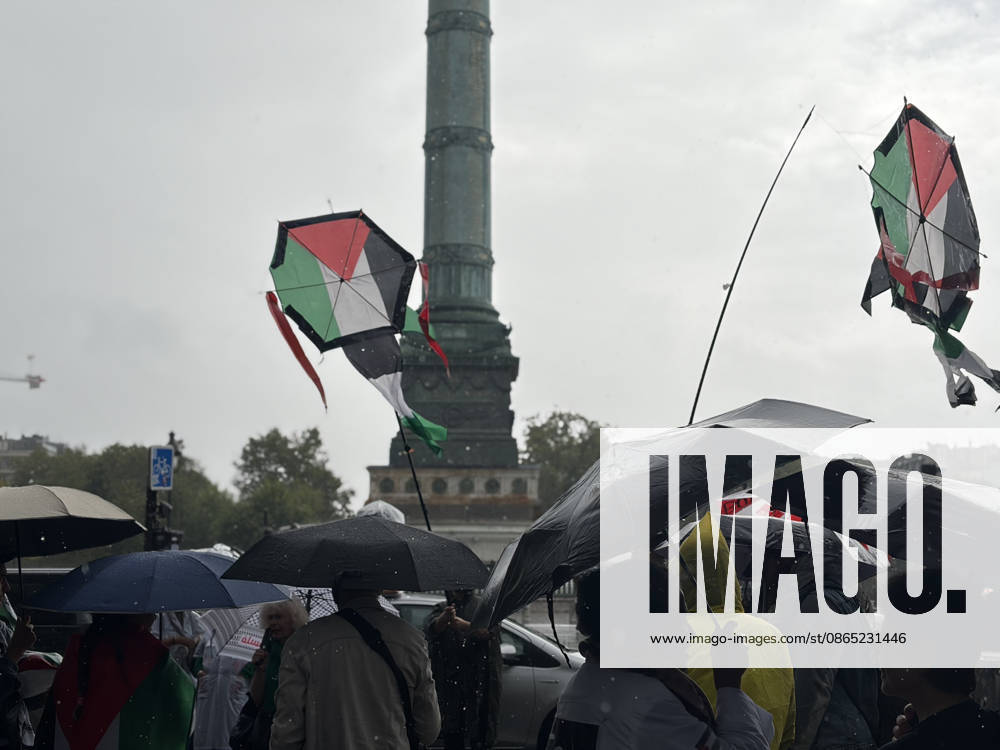 Pro-Palestinian demonstrators march through rain in Paris holding olive branches and kites PARIS, FRANCE - AUGUST 29: Demonstrators hold olive branches and kites while marching through heavy rain near Place de la Bastille in central Paris, France, on August 29, 2026. Gathering despite inclement weather, pro-Palestinian activists paraded toward the historic Fontaine des Innocents, displaying olive branches as symbols of peace and flying kites to draw international attention to the humanitarian crisis in Gaza while demanding an immediate ceasefire and the lifting of blockades. Esra Taskin Anadolu Paris France. Editorial use only. Please get in touch for any other usage.