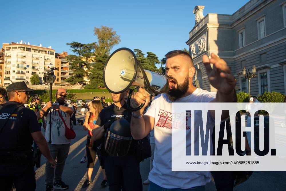 A man wearing a t-shirt from the far-right group Revuelta shouts into a megaphone during a rally in Madrid.Rally organized by far-right groups such as Europe Save Act, Revuelta, and Reconquista in support of remigration, under the slogan Save Spain, save Europe! Madrid Spain - ZUMAs197 20260829_aaa_s197_154