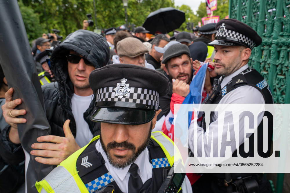 UKIP supporters and police officers confront one another during the No to Sharia Law march and rally in central London. UKIP leader Nick Tenconi led supporters on a march and rally through central London calling for an end to Sharia law in Great Britain. The demonstration, organized under the banner No to Sharia Law, was met by a counter-protest. Tensions rose at the start of the march, with counter-protesters pushing against police officers as officers attempted to keep the opposing groups apart. The Metropolitan Police had imposed conditions on both demonstrations to prevent serious disorder. London United Kingdom - ZUMAs197 20260829_aaa_s197_165
