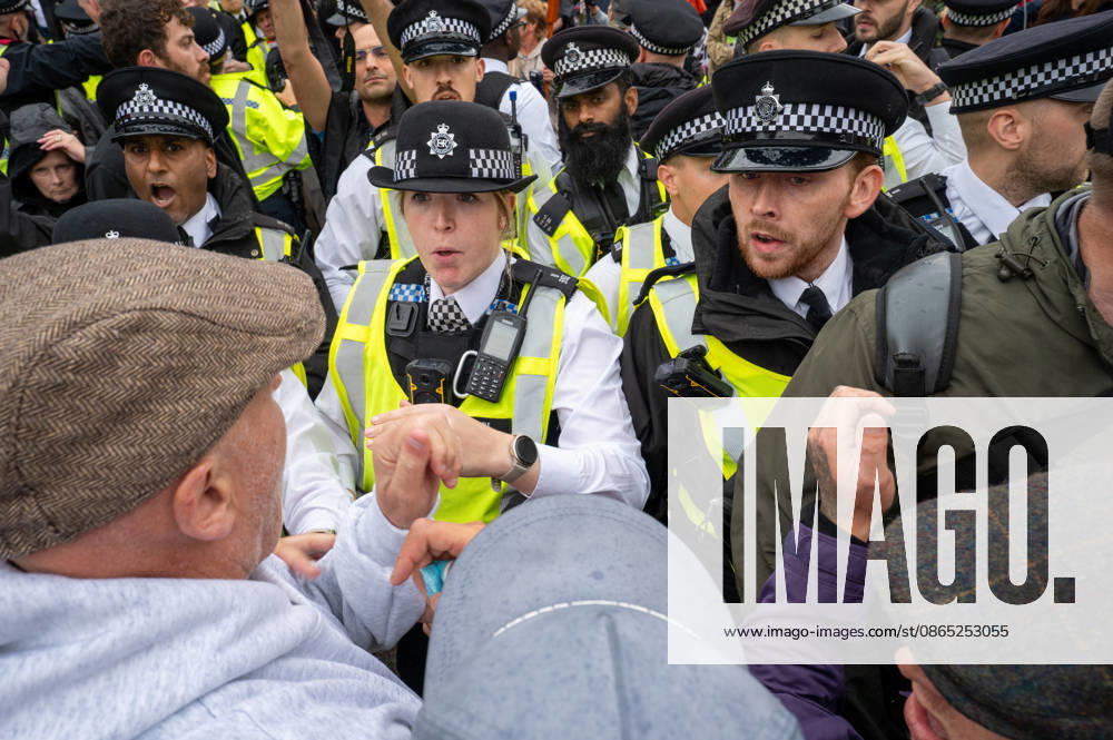 UKIP supporters and police officers confront one another during the No to Sharia Law march and rally in central London. UKIP leader Nick Tenconi led supporters on a march and rally through central London calling for an end to Sharia law in Great Britain. The demonstration, organized under the banner No to Sharia Law, was met by a counter-protest. Tensions rose at the start of the march, with counter-protesters pushing against police officers as officers attempted to keep the opposing groups apart. The Metropolitan Police had imposed conditions on both demonstrations to prevent serious disorder. London United Kingdom - ZUMAs197 20260829_aaa_s197_178