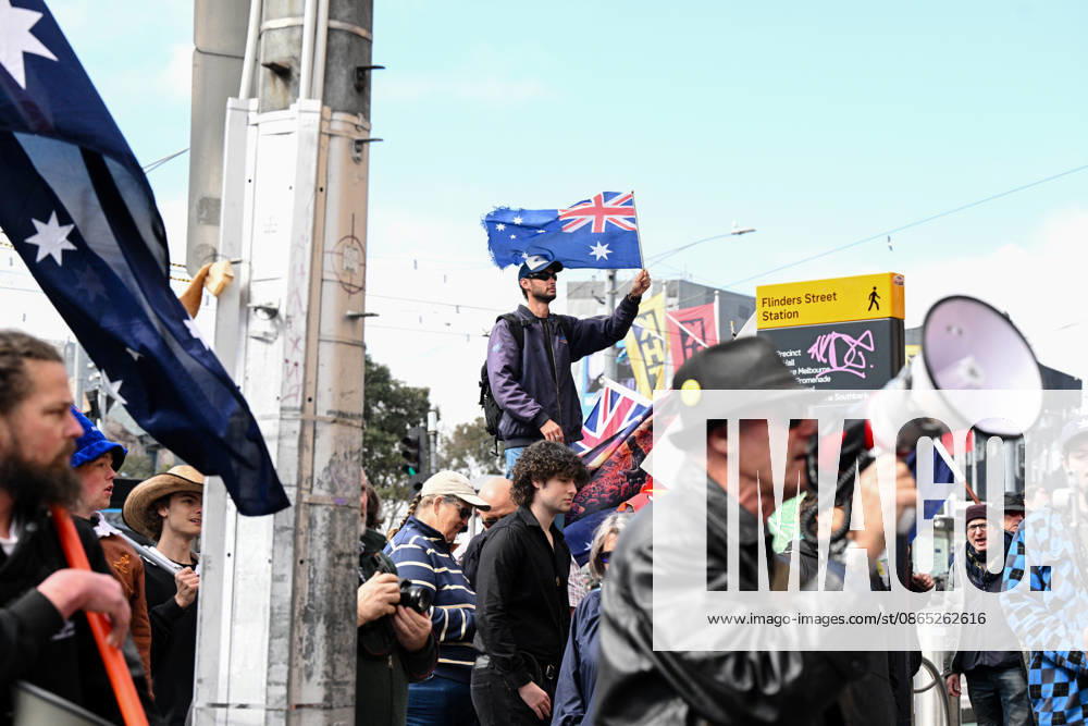 MARCH FOR AUSTRALIA RALLY MELBOURNE, People participate in a March for Australia anti-immigration rally outside the Flinders St Station in Melbourne, Sunday, August 30, 2026. ( NO ARCHIVING Melbourne Victoria AUSTRALIA