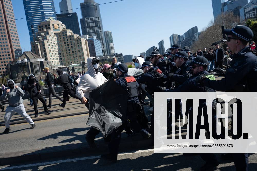 MELBOURNE, AUSTRALIA, AUGUST 30, 2026: Supporters of a demonstration previously promoted as Ã¢â‚¬oeMarch for AustraliaÃ¢â‚¬Â and later described by organizers as a Ã¢â‚¬oeFree SpeechÃ¢â‚¬Â protest gather in Melbourne during an event led by internet personality Hugo Lennon, known online as Ã¢â‚¬oeAuspill.Ã¢â‚¬Â Clashes break out involving protesters, counter-protesters and police, prompting officers to deploy crowd-control spray and pepper-ball rounds. Melbourne Australia - ZUMAq101 20260830_zna_q101_060
