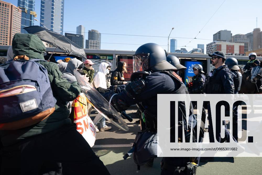 MELBOURNE, AUSTRALIA, AUGUST 30, 2026: Supporters of a demonstration previously promoted as Ã¢â‚¬oeMarch for AustraliaÃ¢â‚¬Â and later described by organizers as a Ã¢â‚¬oeFree SpeechÃ¢â‚¬Â protest gather in Melbourne during an event led by internet personality Hugo Lennon, known online as Ã¢â‚¬oeAuspill.Ã¢â‚¬Â Clashes break out involving protesters, counter-protesters and police, prompting officers to deploy crowd-control spray and pepper-ball rounds. Melbourne Australia - ZUMAq101 20260830_zna_q101_062