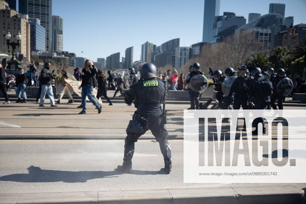 MELBOURNE, AUSTRALIA, AUGUST 30, 2026: Supporters of a demonstration previously promoted as Ã¢â‚¬oeMarch for AustraliaÃ¢â‚¬Â and later described by organizers as a Ã¢â‚¬oeFree SpeechÃ¢â‚¬Â protest gather in Melbourne during an event led by internet personality Hugo Lennon, known online as Ã¢â‚¬oeAuspill.Ã¢â‚¬Â Clashes break out involving protesters, counter-protesters and police, prompting officers to deploy crowd-control spray and pepper-ball rounds. Melbourne Australia - ZUMAq101 20260830_zna_q101_071