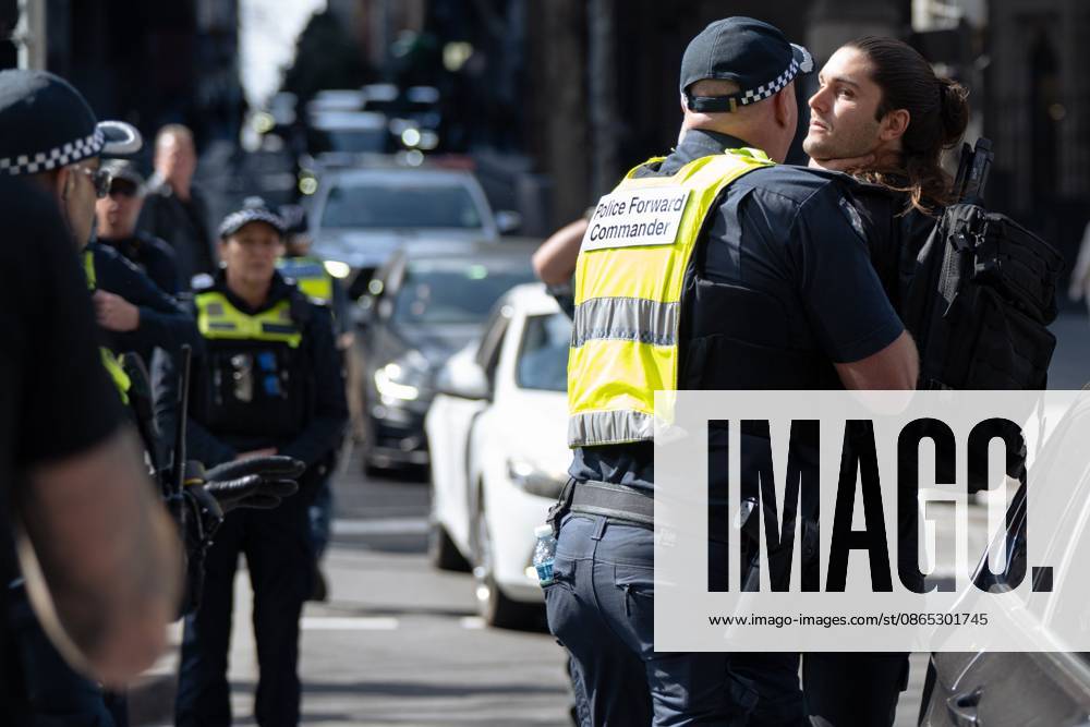 MELBOURNE, AUSTRALIA, AUGUST 30, 2026: Supporters of a demonstration previously promoted as â€oeMarch for Australia†and later described by organizers as a â€oeFree Speech†protest gather in Melbourne during an event led by internet personality Hugo Lennon, known online as â€oeAuspill.†Clashes break out involving protesters, counter-protesters and police, prompting officers to deploy crowd-control spray and pepper-ball rounds. Melbourne Australia - ZUMAq101 20260830_zna_q101_073