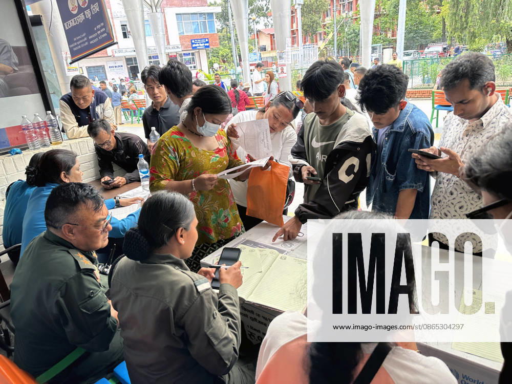 Relatives search for missing family members with police personnel, as photographs of missing people are displayed outside the hospital, four days after devastating flash floods struck areas near the Nepal-China border at Tribhuvan University Teaching Hospital in Maharajgunj, Kathmandu,Nepal on August 30, 2026. According to authorities, 734 people had died and 2,498 remained missing as morning of Aug. 30, 2026, following devastating flash floods that struck areas near the Nepal-China border on Aug. 26. Kathmandu Nepal - ZUMAs233 20260830_zap_s233_008