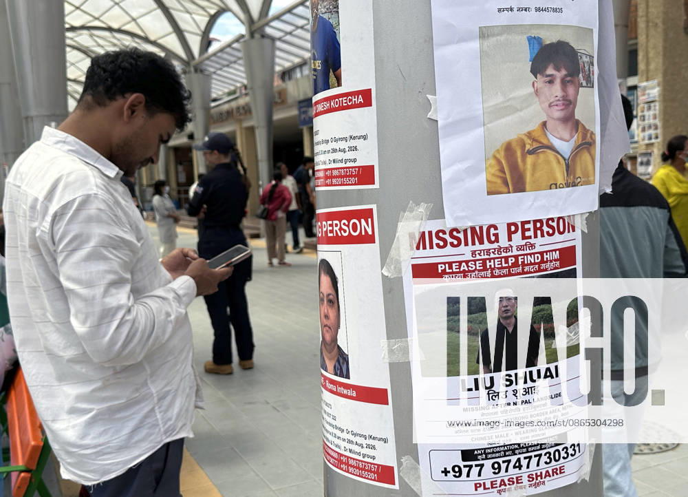 A person search for missing family members as photographs of missing people are displayed outside the hospital, four days after devastating flash floods struck areas near the Nepal-China border at Tribhuvan University Teaching Hospital in Maharajgunj, Kathmandu,Nepal on August 30, 2026. According to authorities, 734 people had died and 2,498 remained missing as morning of Aug. 30, 2026, following devastating flash floods that struck areas near the Nepal-China border on Aug. 26. Kathmandu Nepal - ZUMAs233 20260830_zap_s233_009