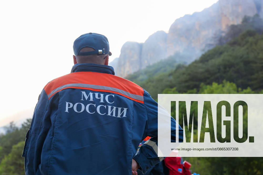 RUSSIA, REPUBLIC OF CRIMEA - AUGUST 30, 2026: Emergency service workers at the scene of a wildfire on Chishma-Kaya Rocks in the vicinity of Mangul-Kale in the Bakhchisarai District. Maxim Churusov TASS 96853715