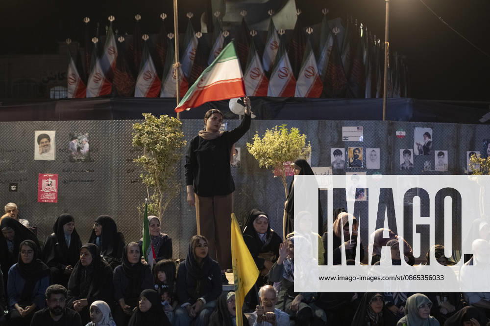 Nightly Pro-Government Rally In Tehran, Iran A young female pro-government supporter waves an Iranian national flag during a nightly rally in downtown Tehran, Iran, on August 30, 2026. U.S. forces strike two Iranian military launchers on Larak Island in the Strait of Hormuz on August 30, in the first reported U.S. attack on Iranian territory since late July. Tehran Tehran Iran