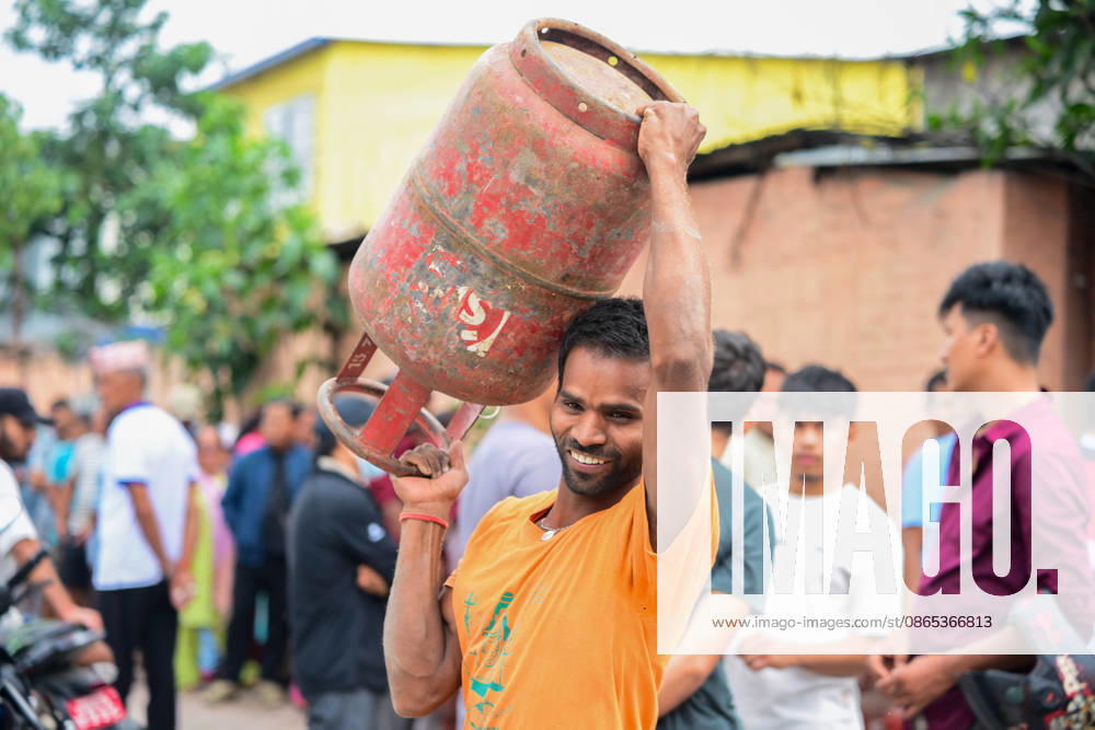 Customers wait in long queues to receive liquefied petroleum gas (LPG) cylinders in Kathmandu, Nepal, on August 31, 2026, as the devastating Rasuwa floods add further pressure to an already strained cooking gas distribution system. Nepal had already been facing long queues and difficulties obtaining LPG, with increased demand and distribution problems affecting consumers. The catastrophic flash floods that struck near the Nepal-China border on August 26 swept away homes, vehicles, roads, bridges and other infrastructure, while LPG cylinders were also carried away by the powerful floodwaters. Some people were seen entering the floodwaters and swimming to retrieve the cylinders. The disaster disrupt - ZUMAs330 20260831_zsp_s330_001
