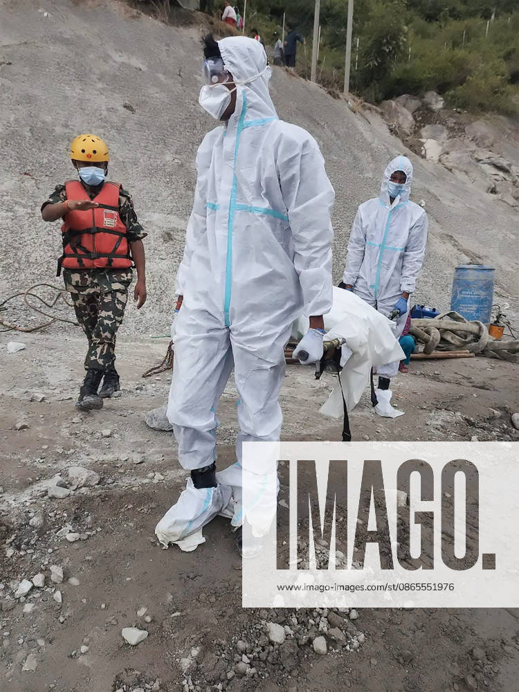 Security personnel carry the body of an unidentified flood victim for mass burial at Gokarna Forest Reserve in Kathmandu on Tuesday, September 1, 2026. The death toll has surpassed 1,000, with dozens feared trapped inside tunnels of hydroelectric power stations. photo by Nepalese Army NEP2026090116 NepalesexArmy