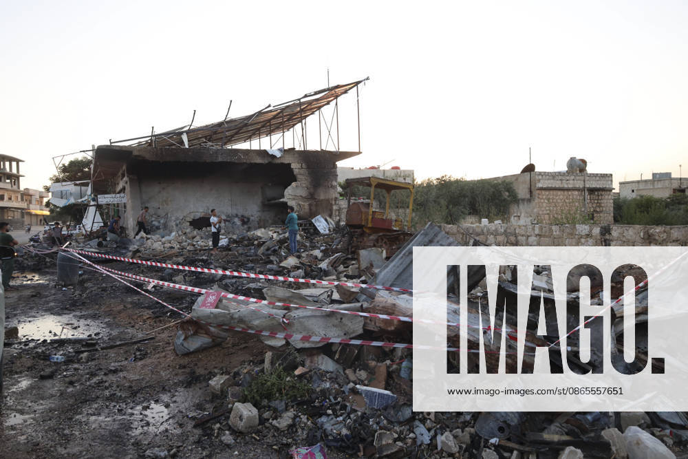 Binnish Syria Ammunition Explosion People inspect a damaged building and debris at the site of an explosion in Binnish, Idlib Governorate, Syria, on September 1, 2026. Five people were killed and several others injured when a vehicle loaded with ammunition exploded in Binnish, according to Syrian authorities, while the cause remained unclear and emergency crews worked to secure scattered munitions and prevent further explosions. Binnish Idlib Syria