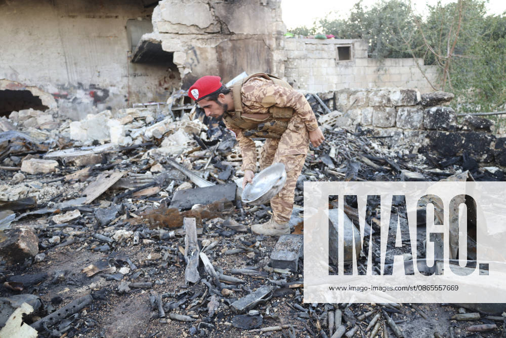 Binnish Syria Ammunition Explosion A uniformed man inspects debris at the site of an explosion in Binnish, Idlib Governorate, Syria, on September 1, 2026. Five people were killed and several others injured when a vehicle loaded with ammunition exploded in Binnish, according to Syrian authorities, while the cause remained unclear and emergency crews worked to secure scattered munitions and prevent further explosions. Binnish Idlib Syria