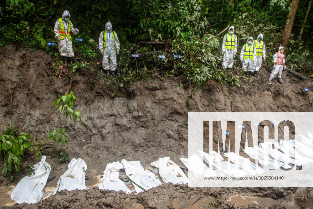 Aftermath flash flood in Nepal Rescue workers and officials manage a mass burial trench for unidentified remains recovered after severe flash floods in Gokarna, Kathmandu. Kathmandu Nepal