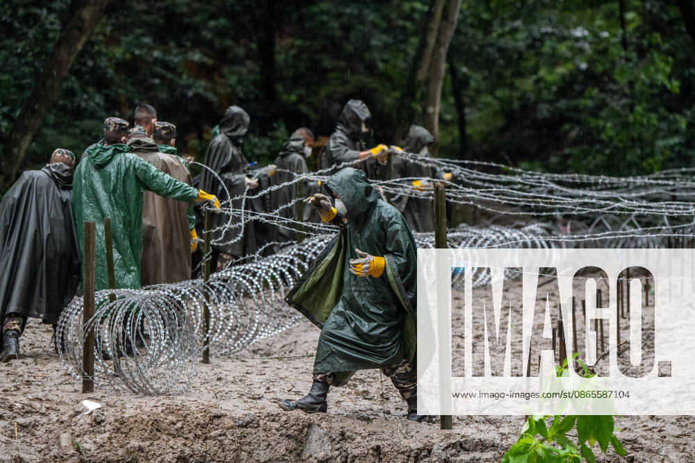Rescue workers and officials manage a mass burial trench for unidentified remains recovered after severe flash floods in Gokarna, Kathmandu. Authorities initiated temporary burials as morgue capacities reached limits following the disaster. Kathmandu Nepal - ZUMAs197 20260901_aaa_s197_260
