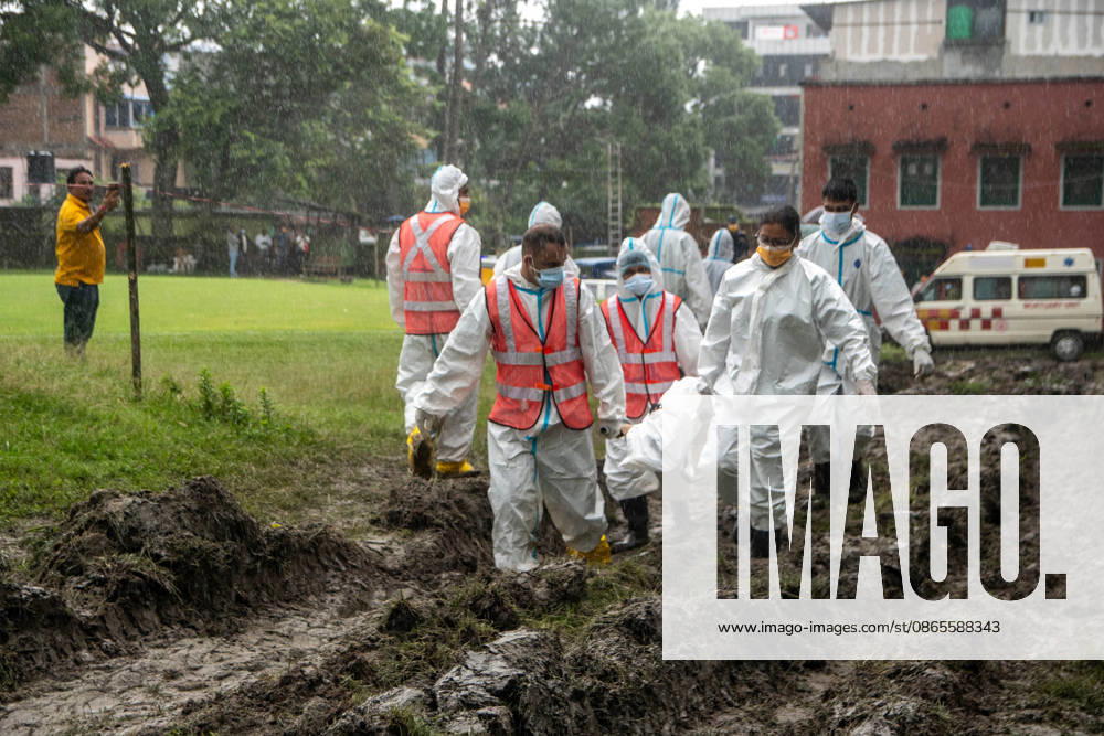 Bodies of unidentified victims wrapped in shrouds lie at a temporary burial trench in Gokarna, Kathmandu. Emergency teams collected DNA samples and forensic records prior to interment to assist family identification efforts later. Kathmandu Nepal - ZUMAs197 20260901_aaa_s197_232