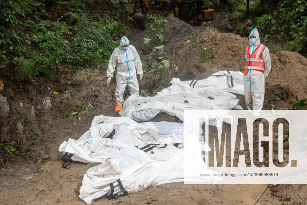 Bodies of unidentified victims wrapped in shrouds lie at a temporary burial trench in Gokarna, Kathmandu. Emergency teams collected DNA samples and forensic records prior to interment to assist family identification efforts later. Kathmandu Nepal - ZUMAs197 20260901_aaa_s197_236