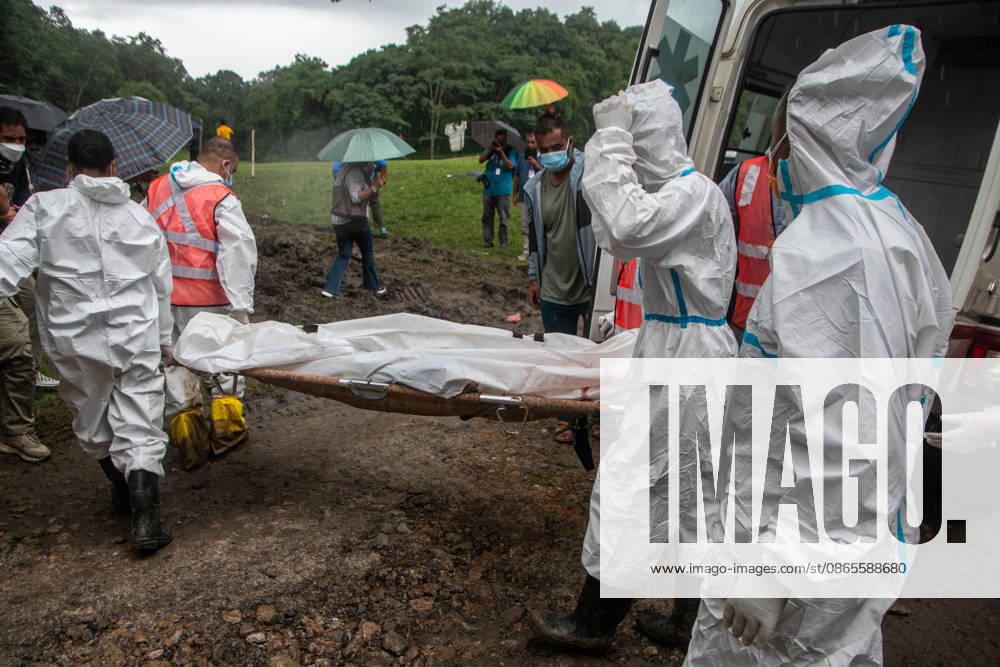 Bodies of unidentified victims wrapped in shrouds lie at a temporary burial trench in Gokarna, Kathmandu. Emergency teams collected DNA samples and forensic records prior to interment to assist family identification efforts later. Kathmandu Nepal - ZUMAs197 20260901_aaa_s197_238
