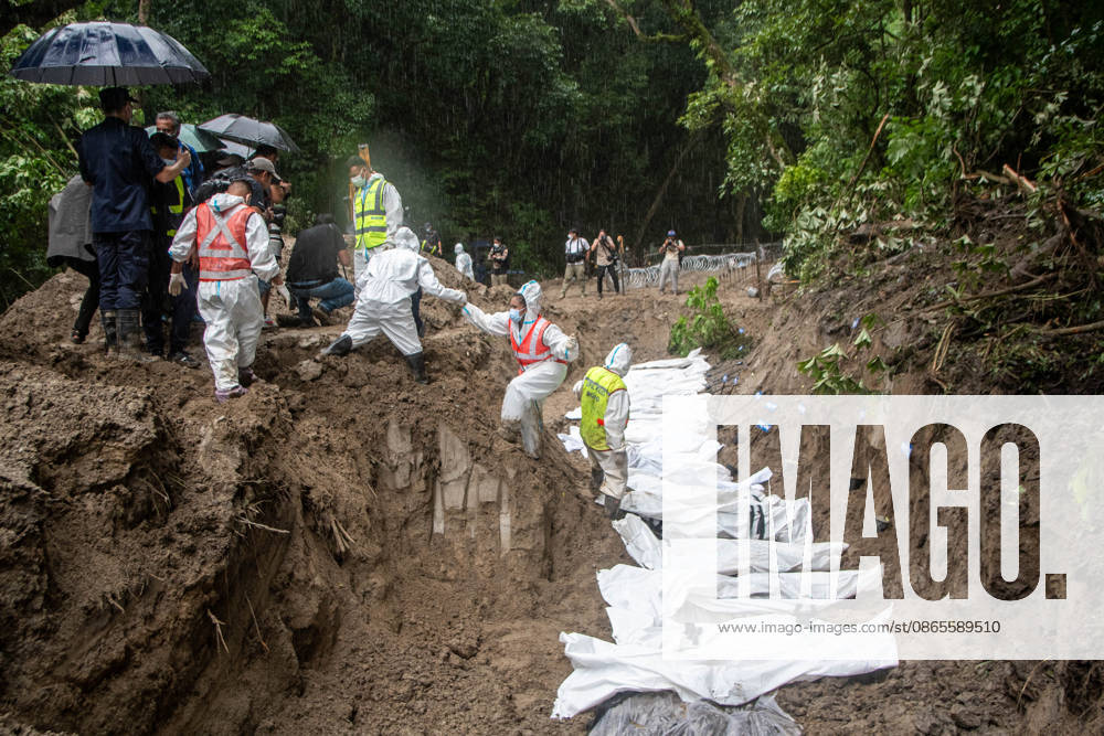 Bodies of unidentified victims wrapped in shrouds lie at a temporary burial trench in Gokarna, Kathmandu. Emergency teams collected DNA samples and forensic records prior to interment to assist family identification efforts later. Kathmandu Nepal - ZUMAs197 20260901_aaa_s197_249