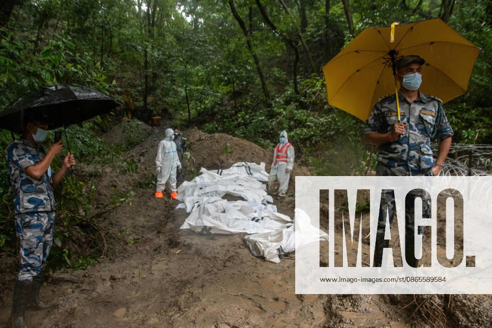 Bodies of unidentified victims wrapped in shrouds lie at a temporary burial trench in Gokarna, Kathmandu. Emergency teams collected DNA samples and forensic records prior to interment to assist family identification efforts later. Kathmandu Nepal - ZUMAs197 20260901_aaa_s197_255