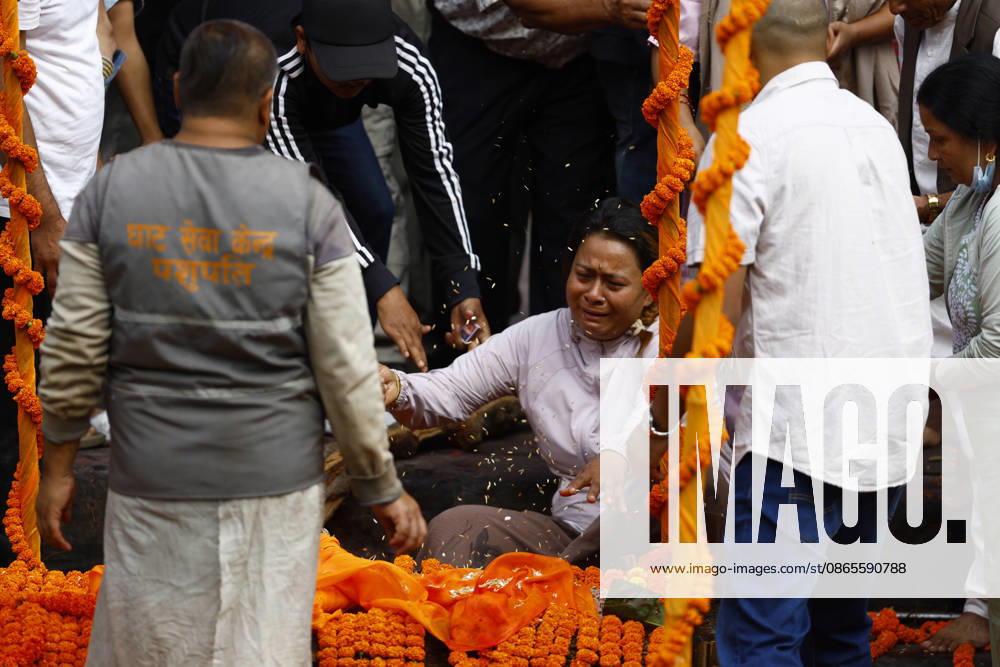 Relatives perform the final rites of Suraj Timilsina, 32, using a symbolic effigy made of straw and barley grains after his body could not be recovered following the devastating floods, at Pashupatinath Temple in Kathmandu, Nepal, on Wednesday, September 2, 2026. Suraj, originally from Sindhupalchok, was involved in an import-export and transport business in Timure, Rasuwa, and was swept away by the floods. He is survived by his wife, Ayusha Timilsina, 27, and their six-year-old son and three-year-old daughter. As thousands remain missing and many bodies have yet to be recovered, families have begun performing final rites for loved ones without their remains. The floods have killed more than 1,000 people - ZUMAg200 20260902_zap_g200_004