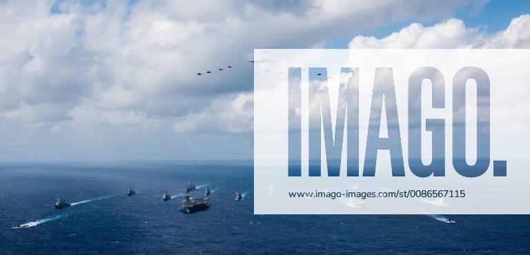 Philippine Sea, Philippines - The U.S. Navy aircraft carrier USS Ronald Reagan and the Japanese helicopter destroyer JS Hyuga sail in formation with 16 other ships from the U.S. Navy and Japan Maritime Self-Defense Force during during Keen Sword 2019 November 8, 2018 in the Philippine Sea. Philippine Sea Philippines - ZUMAp138 20181108_zaa_p138_003