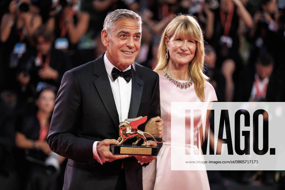 American actor and producer, George Clooney and american actress, Laura Dern seen holding the Honorary Golden Lion Award at the 83rd Venice International Film Festival at the Palazzo del Cinema. Venice Italy - ZUMAs197 20260902_aaa_s197_507