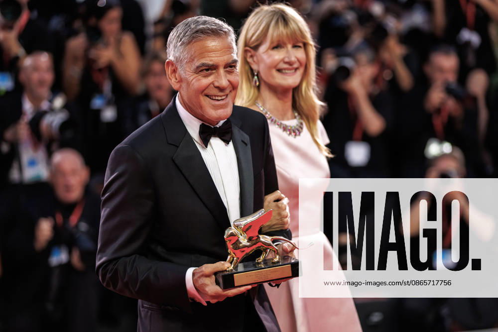 American actor and producer, George Clooney and american actress, Laura Dern seen holding the Honorary Golden Lion Award at the 83rd Venice International Film Festival at the Palazzo del Cinema. Venice Italy - ZUMAs197 20260902_aaa_s197_515