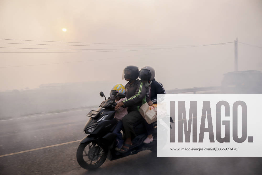 Forest and Peatland Fire in Ogan Ilir, South Sumatra A resident rides a motorcycle through the haze along the Palembang - Inderalaya Highway in South Sumatra, Indonesia, on September 5, 2026. South Sumatra Indonesia