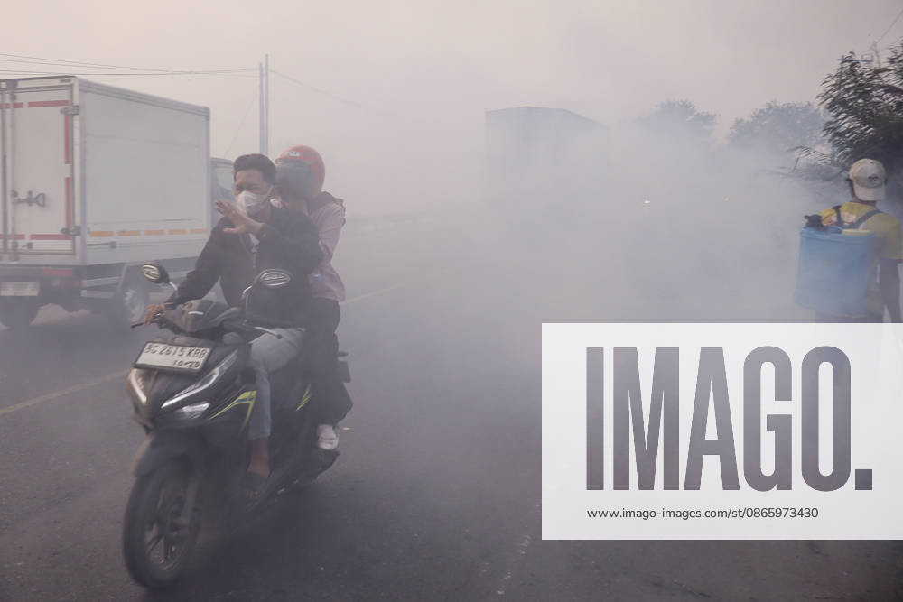 Forest and Peatland Fire in Ogan Ilir, South Sumatra A resident rides a motorcycle through the haze along the Palembang - Inderalaya Highway in South Sumatra, Indonesia, on September 5, 2026. South Sumatra Indonesia